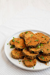 Homemade Garlic Parmesan Baked Eggplant on a plate, side view. Copy space.