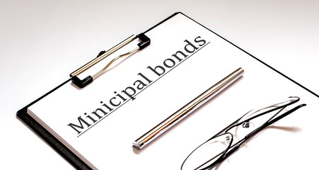 Paper with MINICIPAL BONDS on a table