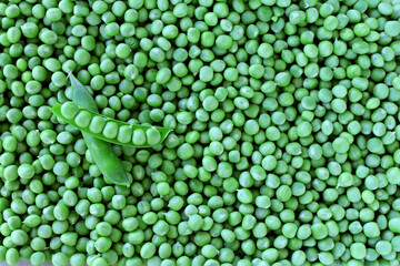 Green peas background. Organic food. Peeled green peas.