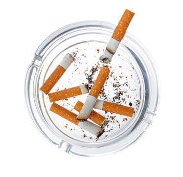 Burnt cigarette butts in an ash tray isolated on white