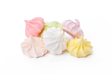 Pile of colorful meringue cookies isolated on white