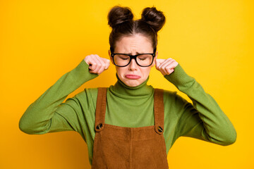 Photo of sad sorry lady two funny buns geek nerd student failed examination crying unhappy wiping...