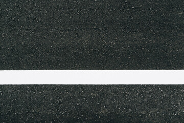 Asphalt road textured with white line for background.