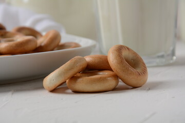 Round bread bagels with milk on white background