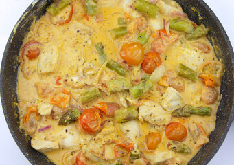 Chicken curry with asparagus tomato and mushrooms