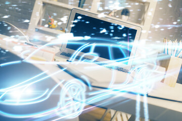 Desktop computer background in office with automobile hologram drawing. Multi exposure. Tech concept.