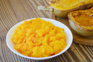 Fresh homemade pumpkin puree in bowl. Baby food. Fresh, organic pureed vegetables.