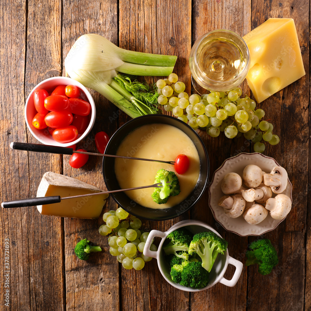 Wall mural cheese fondue with fresh vegetable- broccoli, tomato, potato and mushroom