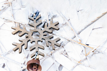 Wooden Winter Snowflake Motif on White Raffia Background