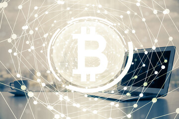 Double exposure of blockchain theme hologram and table with computer background. Concept of bitcoin crypto currency.