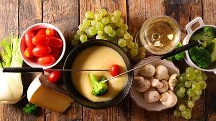 cheese fondue with fresh vegetable- broccoli, tomato, potato and mushroom