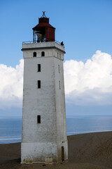 Famous Rubjerg Knude Fyr on the Dune Cliff of the northern Jutland, Denmark, Europe