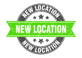 Fototapeta premium new location round stamp with ribbon. label sign