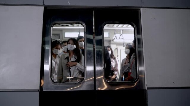 Passenger People With Face Mask Waiting In Metro Train To Walk Out From Automatic Door In Front Of Them At Subway Station.