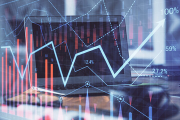 Forex Chart hologram on table with computer background. Double exposure. Concept of financial markets.