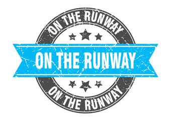 on the runway round stamp with ribbon. label sign