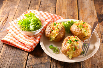 baked potato with cheese, cream, bacon and broccoli