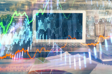 Fototapeta na wymiar Double exposure of chart and financial info and work space with computer background. Concept of international online trading.