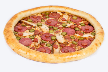 Pizza with sausage, pickles and cheese on a white plate