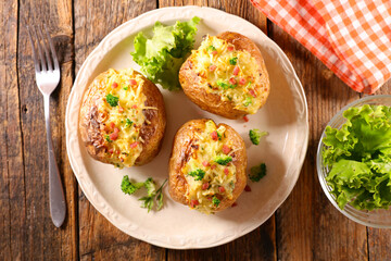 baked potato with cheese, cream, bacon and broccoli
