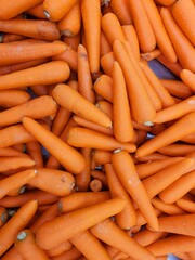 A pile of carrots. Fresh vegetable orange carrots