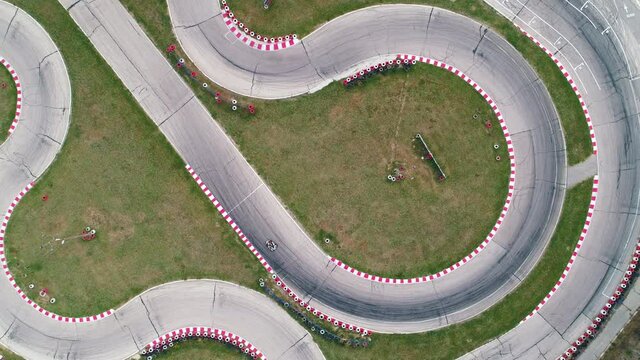 Karting race track, aerial view background. Competition. Buggy kart racing around curves.
