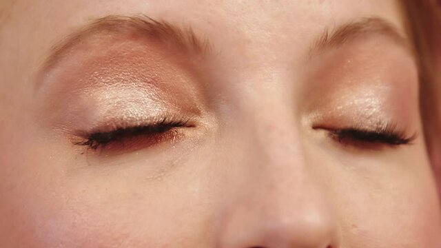 Extreme Closeup Of Woman's Eyes With Neutral And Metallic Glitter Eyeshadow Make-up - Slow Motion