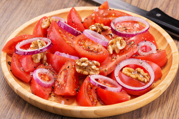 amazing tomato salad with walnuts and red onions