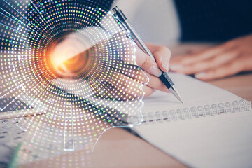 Double exposure of woman's writing hand on background with brain hud. Concept of learning.