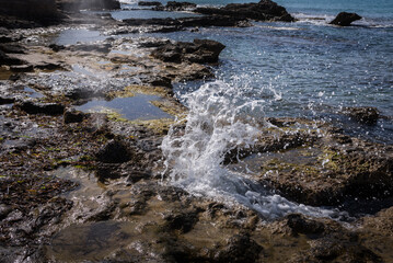 Sea wave hits the rocky beach, Calpe, Alicante, Spain