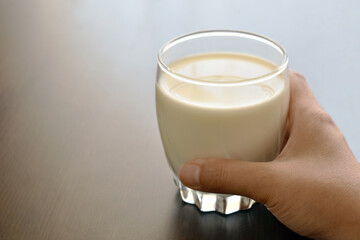Milk in glass with copy space on the left side. 