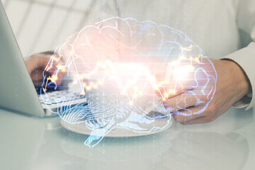 Man with computer background with brain theme hologram. Concept of brainstorm. Double exposure.