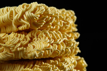 Instant noodles or instant ramen are noodles sold in a precooked and dried block with flavoring powder