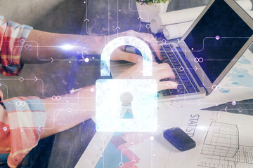 Multi exposure of lock icon with man working on computer on background. Concept of network protection.