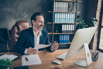 Portrait of his he nice handsome cheery man ceo boss chief expert specialist attending web meeting global organization development plan at modern concrete industrial workplace workstation