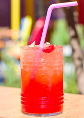 A glass of fruit strawberry cocktail with copyspace for a text