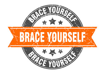 brace yourself round stamp with ribbon. label sign