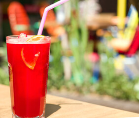 A glass of fruit strawberry cocktail with copyspace for a text