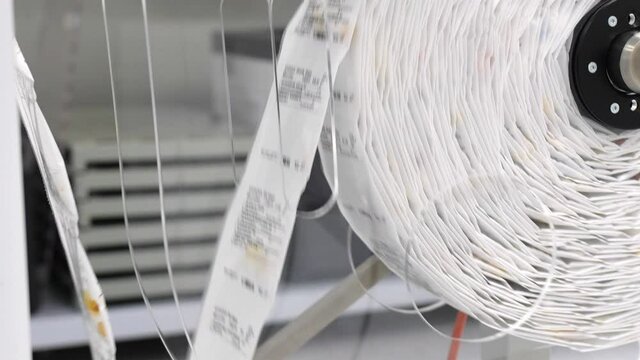 Roll of packaged pills in factory production line