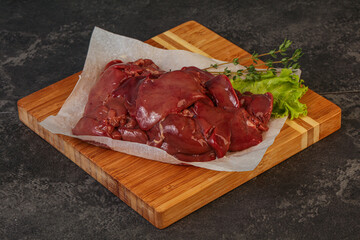 Raw chicken liver over board