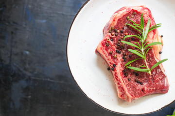 fresh raw steak rib eye meat beef juicy on the table serving size top view copy space for text food background rustic