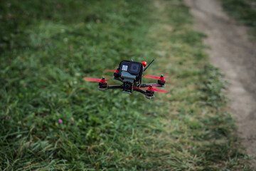 The flying racing drone is ready for the race.