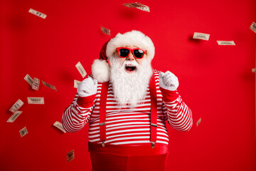 Photo of pensioner old man grey beard raise fists open mouth money shower wear santa x-mas costume...