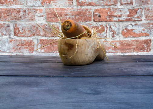 A wooden shoe with hay for the Dutch fest of Sinterklaas. Room for text. 
