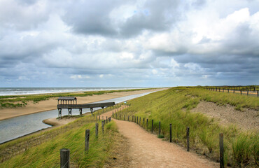 Coastal protection dike near Petten (Netherlands); it has between 2013 and 2015 been reenforced with 20 million m3 of sand, creating two additional rows of dunes and a waterbird area with lookout.