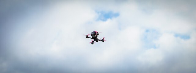 Banner The flying racing drone is ready for the race.