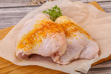 Raw chicken thigh with spices