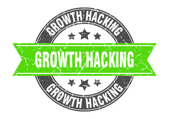 Fototapeta premium growth hacking round stamp with ribbon. label sign
