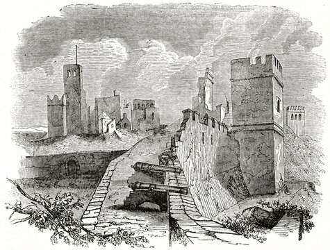 Old view of Badajoz castle ruins, Spain. Cannons on outer walls. Ancient engraving style art by unidentified author, The Penny Magazine, London 1837