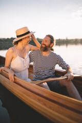 Couple enjoying a summer canoe ride